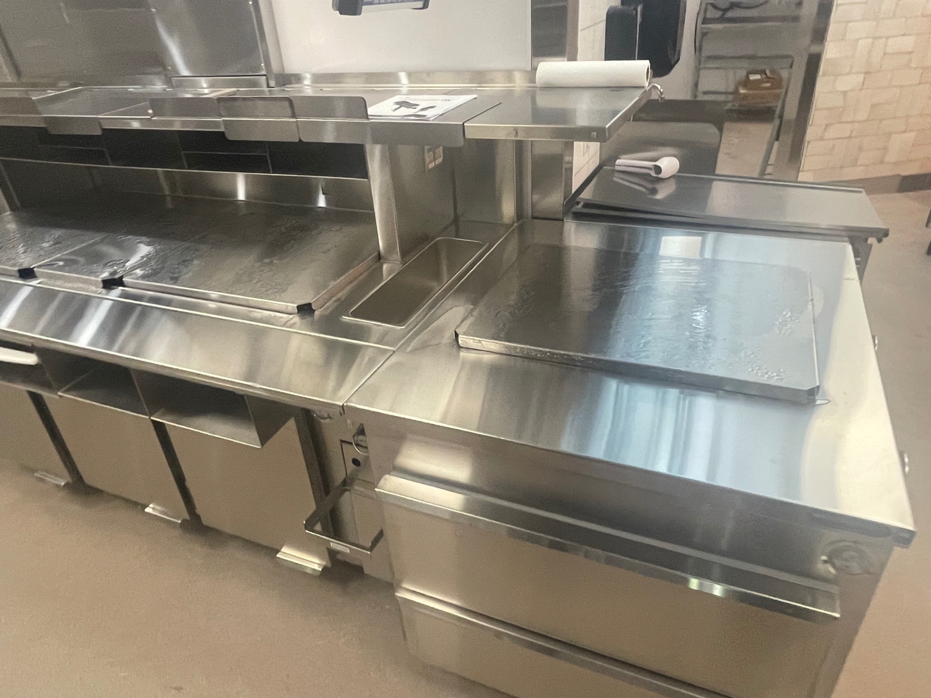 Cleaned stainless prep tables and refrigerated prep line
