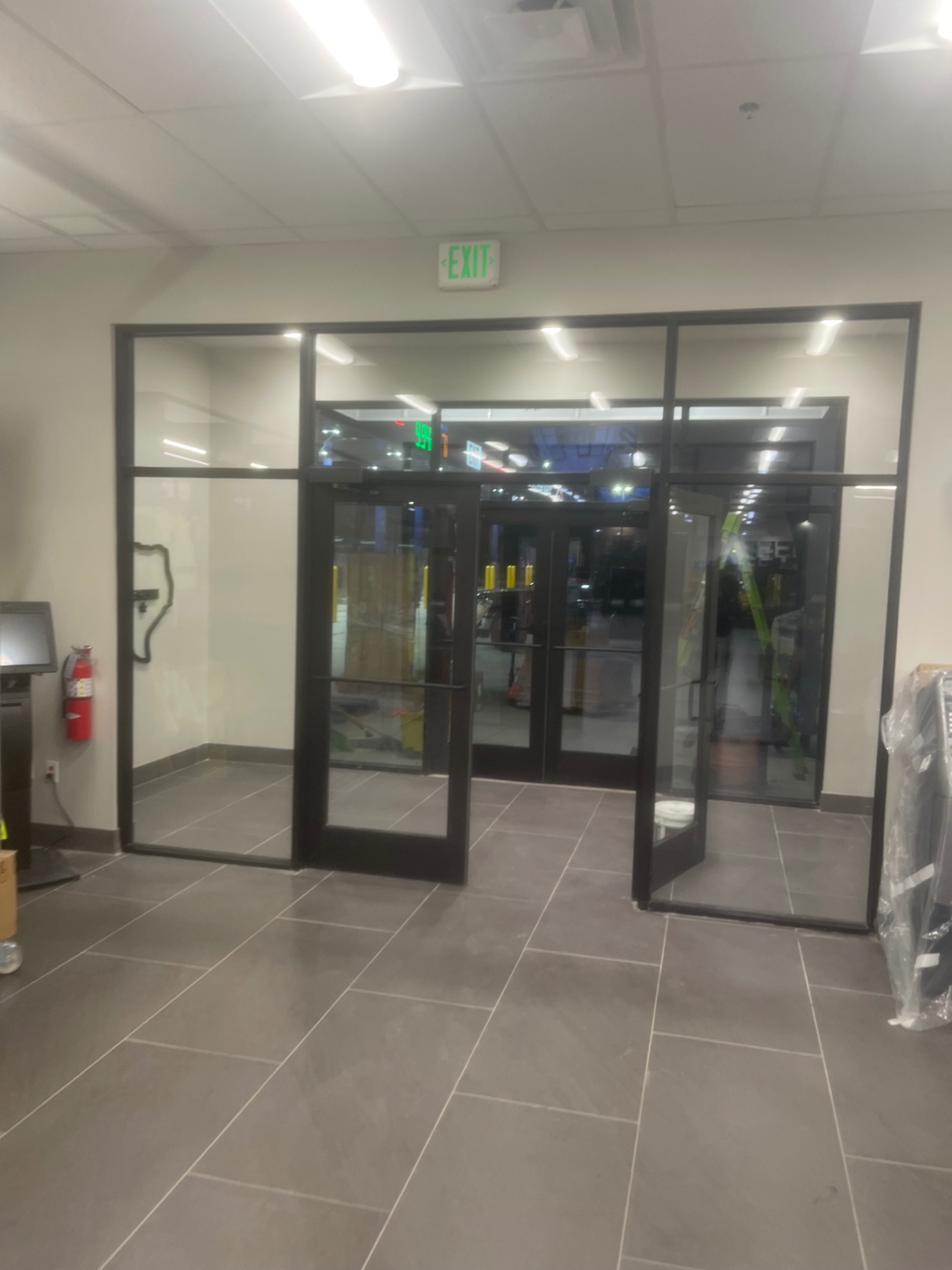 Cleaned entry vestibule with glass storefront doors and tile floor
