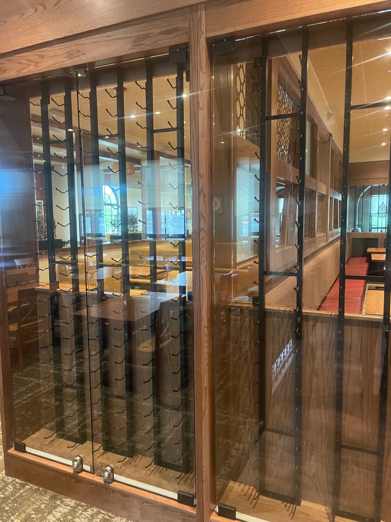 Cleaned glass-front wine display cabinet in the front of house