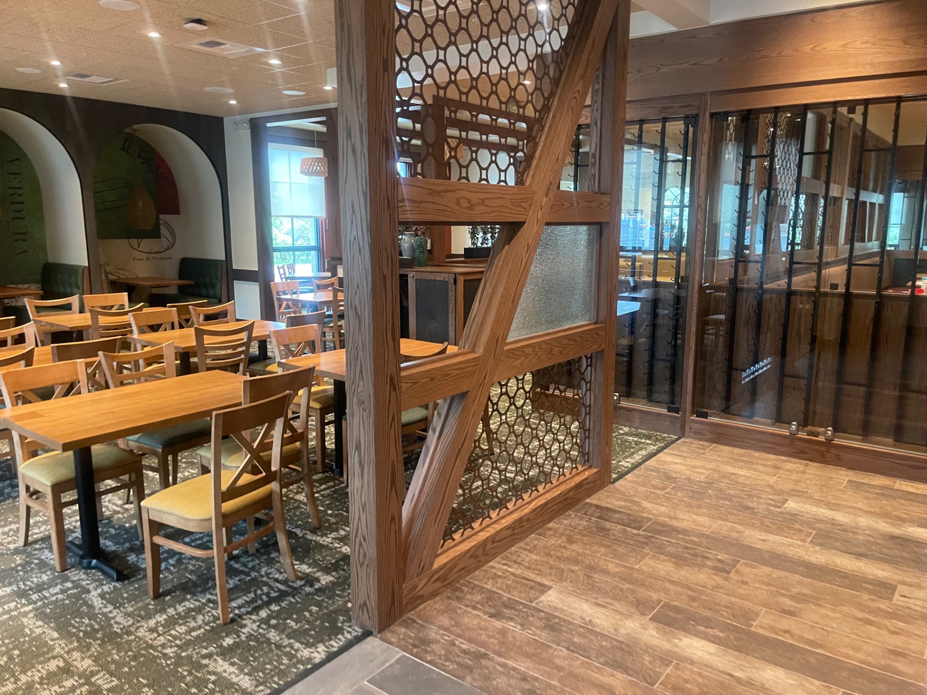 Cleaned wood partition, tile floor and glass wine display in the dining area